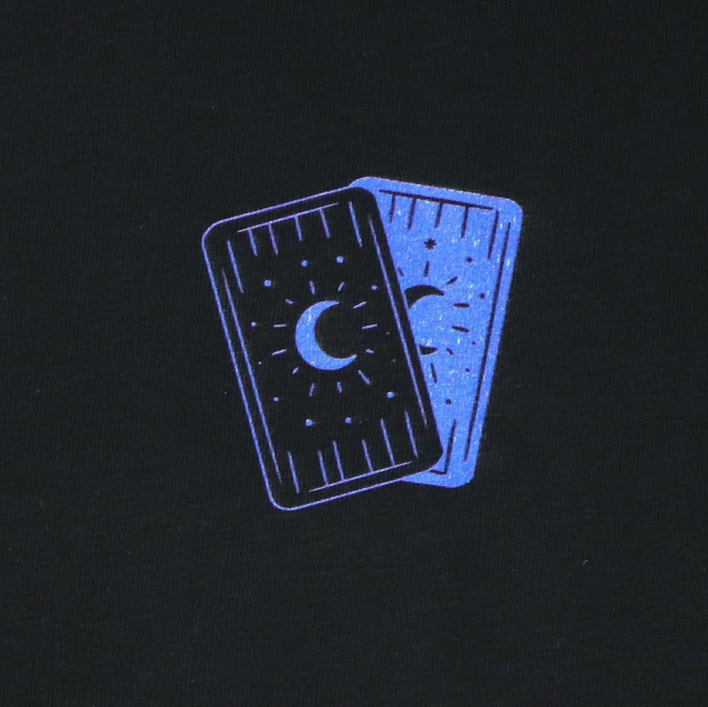 Closeup of small front left wearing chest print featuring the backs of two tarot cards in cobalt blue